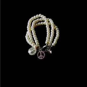 Faux Pearl Two Strand Bracelet with Charms. Cute addition for your jewelry box!